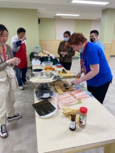 youth making Korean Kimbap
