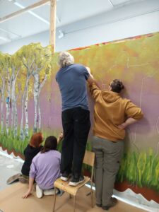 youth working on mural