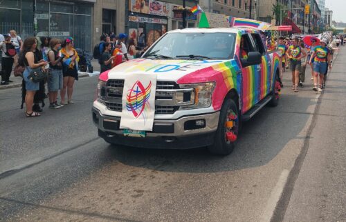 Colorful truck at the front of a parade