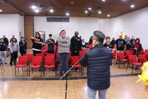 Large group singing with Pastor Jeff leading