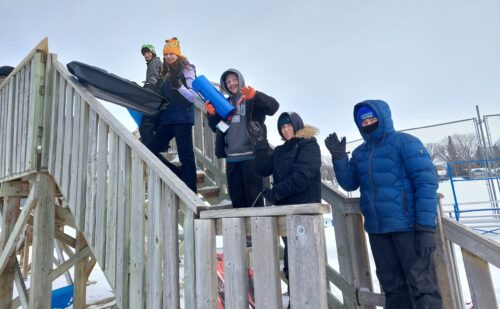 Toboggan run with youth lined up