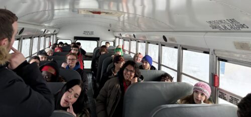 All the youth on a bus singing